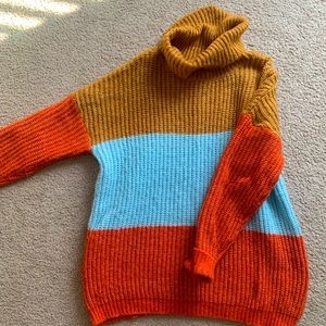 Cute and vibrant knit color block sweater. Perfect for an oversized look.